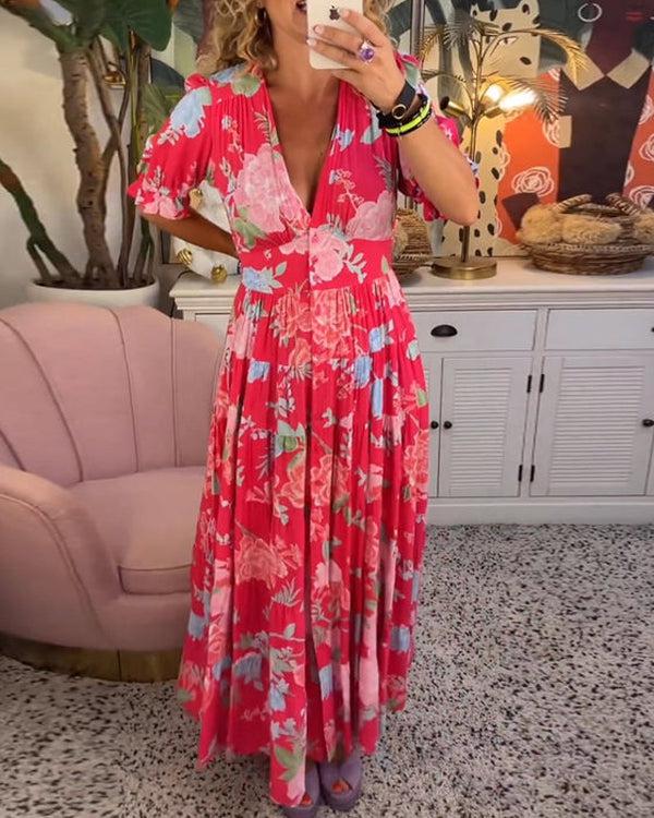 Floral maxi dress in red with pink flowers and blue accents, V-neck and puff sleeves