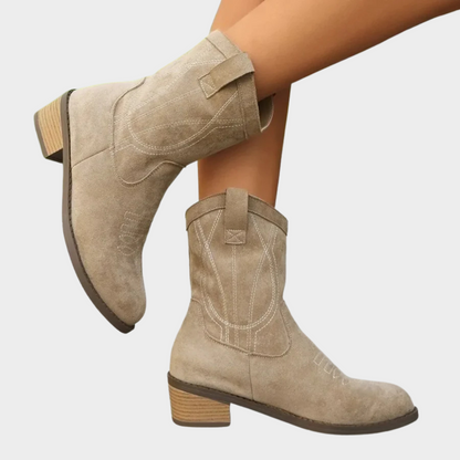 Light taupe suede cowboy ankle boots, heel and shaft detail with stitched patterns