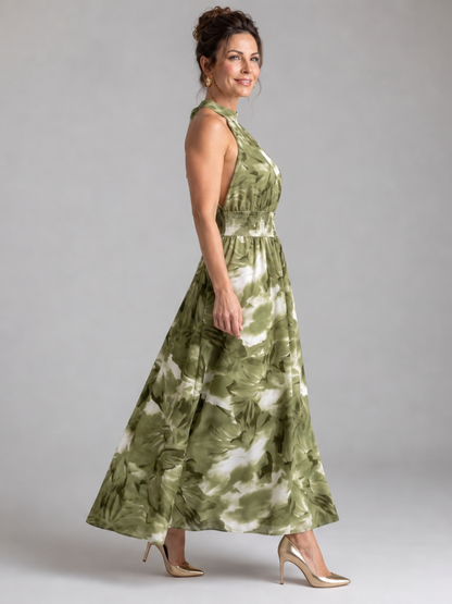 Green abstract print midi dress with halter neck and gathered waist, side view