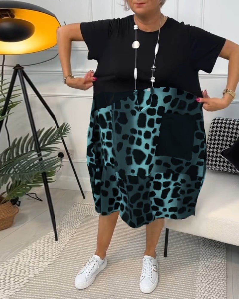 Women's black midi dress with teal leopard print panels, short sleeves, loose fit