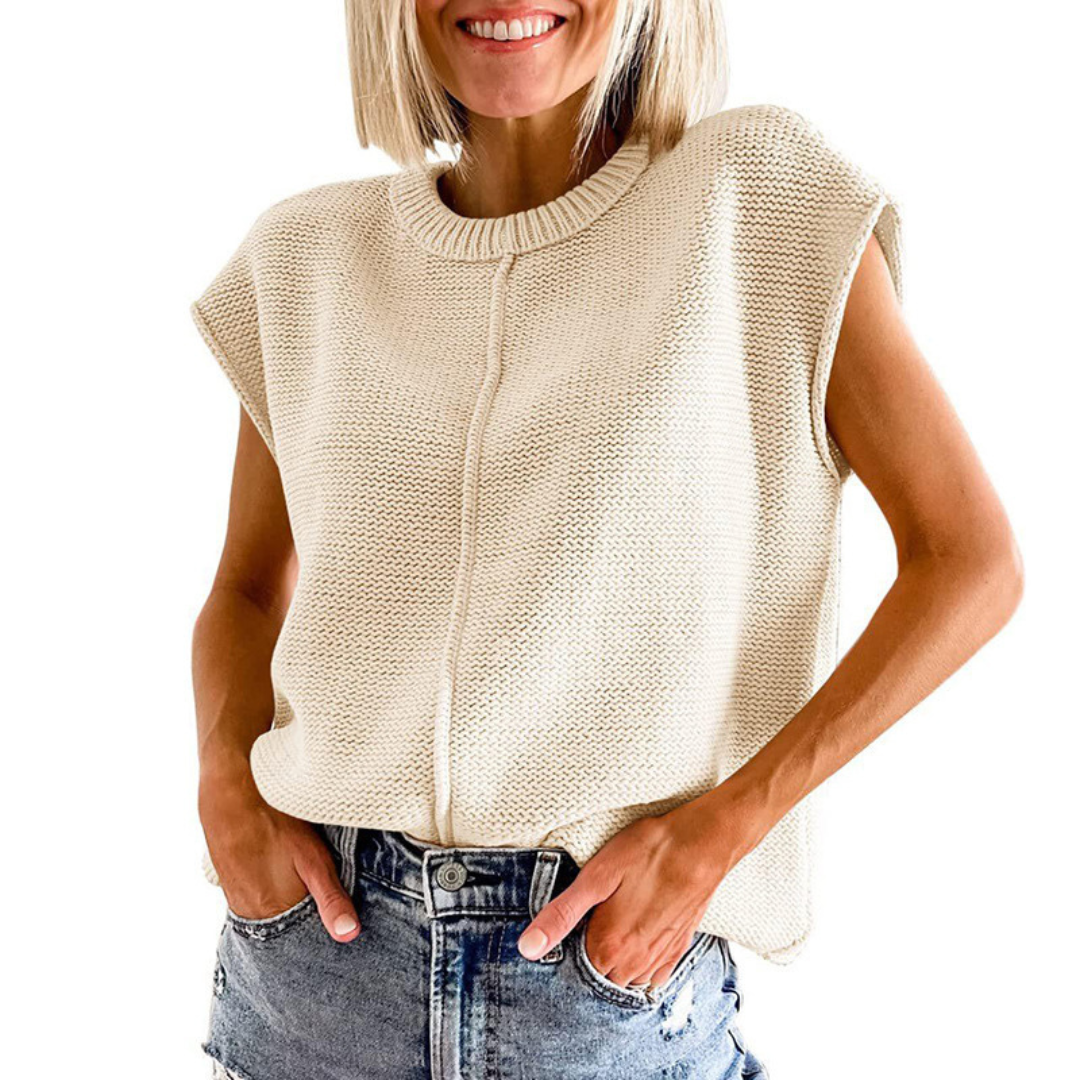 Light beige sleeveless crewneck knit top with ribbed collar and center seam