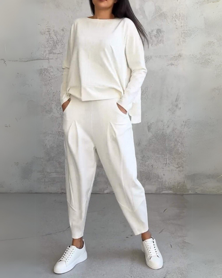White lounge set: long-sleeve pullover top with matching tapered trousers