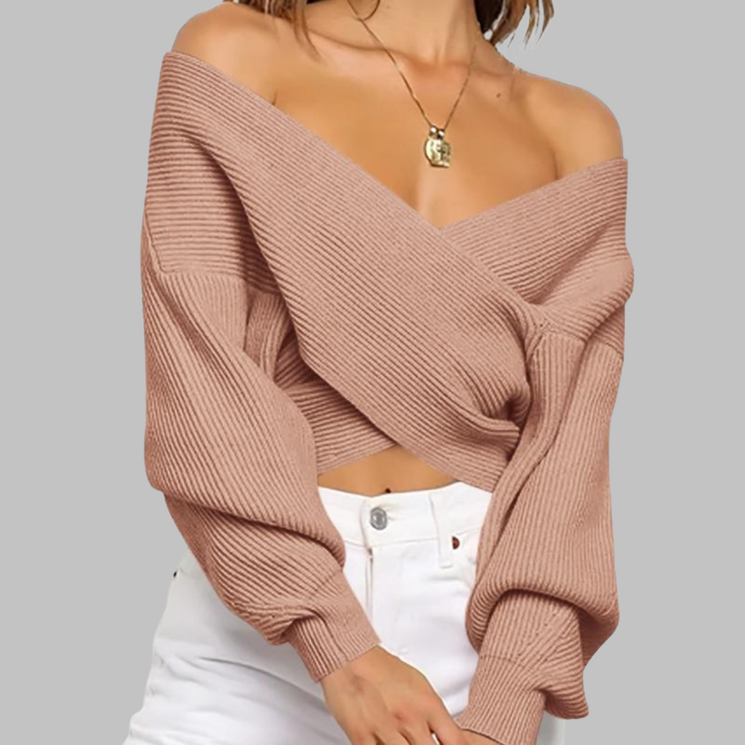 Blush wrap-front V-neck sweater with long sleeves and fine ribbed knit texture
