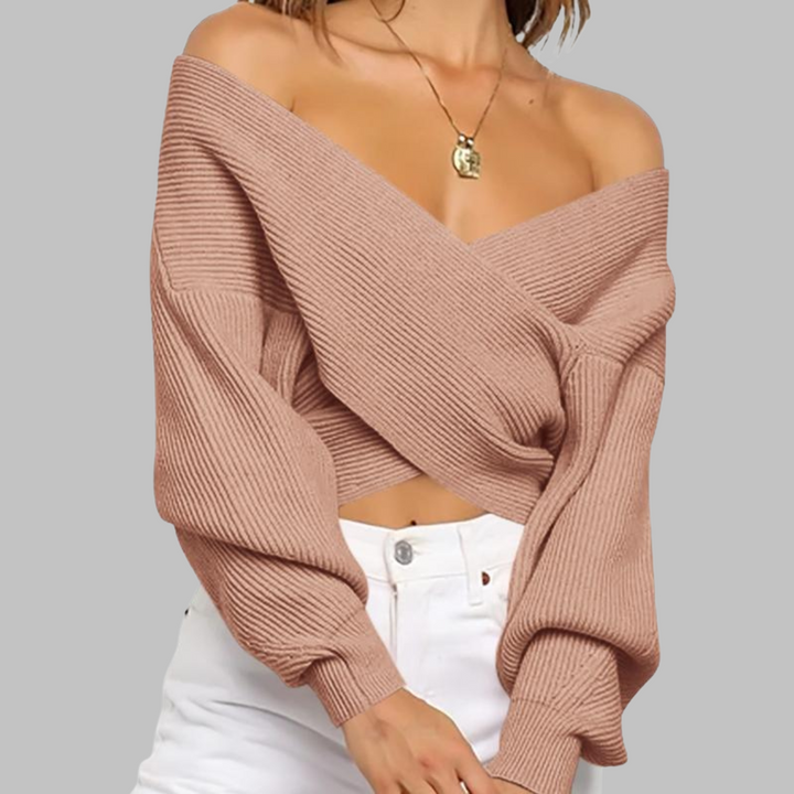 Blush wrap-front V-neck sweater with long sleeves and fine ribbed knit texture