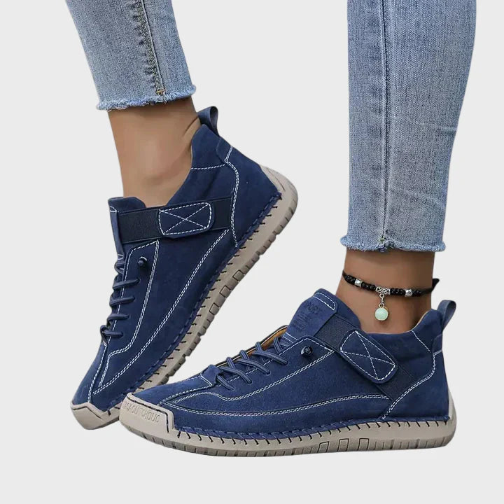 Orthopedic sneakers in dark blue with lace-up front, ankle strap, and stitched rubber sole
