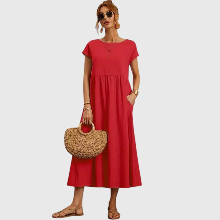 Red midi dress with short sleeves and gathered waist seam; relaxed fit.