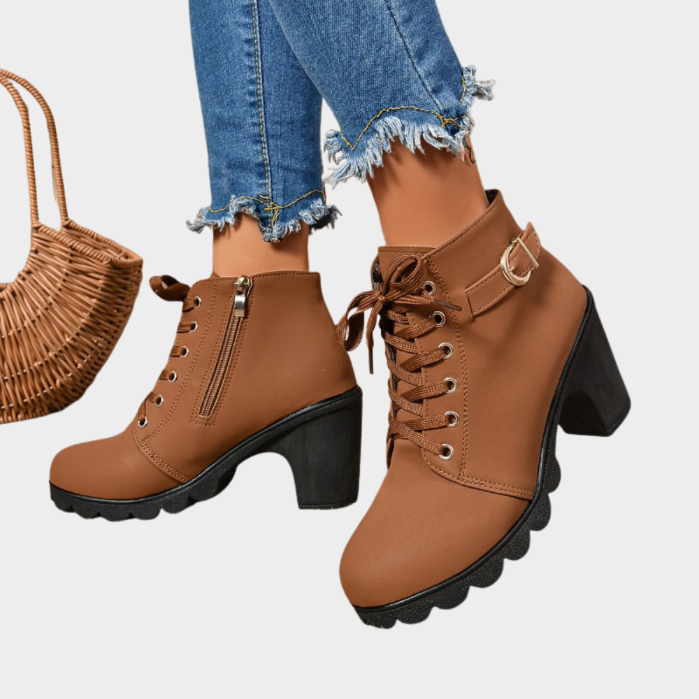 Brown block-heel ankle boots with lace-up front, side zipper, and buckle strap.