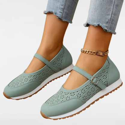 Women's light blue perforated Mary Jane sneakers with buckle strap and rubber sole