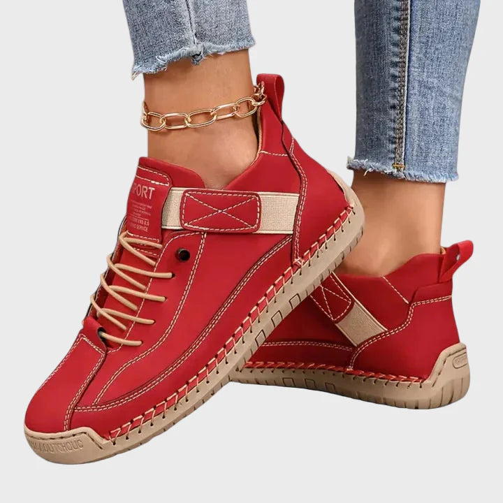 Orthopedic sneakers in red with lace-up front, ankle strap, and stitched rubber outsole
