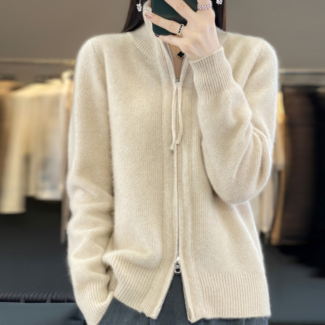 Cream zip-front knit sweater with ribbed collar and cuffs