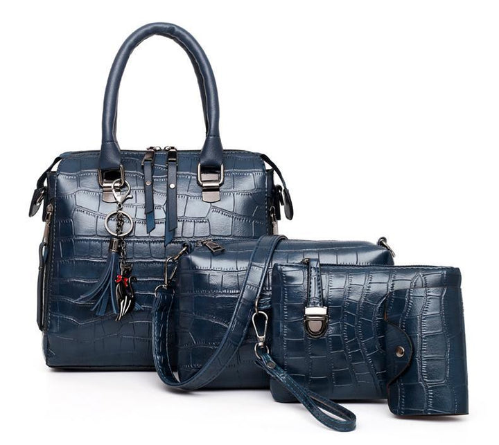 Blue croc-pattern 4-piece handbag set with top handle, shoulder strap, and matching wallet pouch