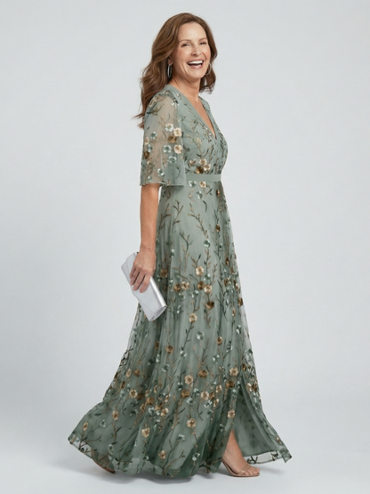 Sage green maxi dress with V-neck and short sleeves, floral print, flowing skirt
