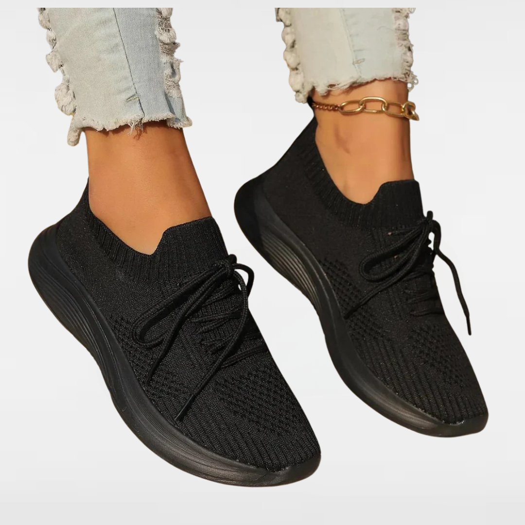 Black knit lace-up sneakers with round toe and chunky sole, sock-style collar