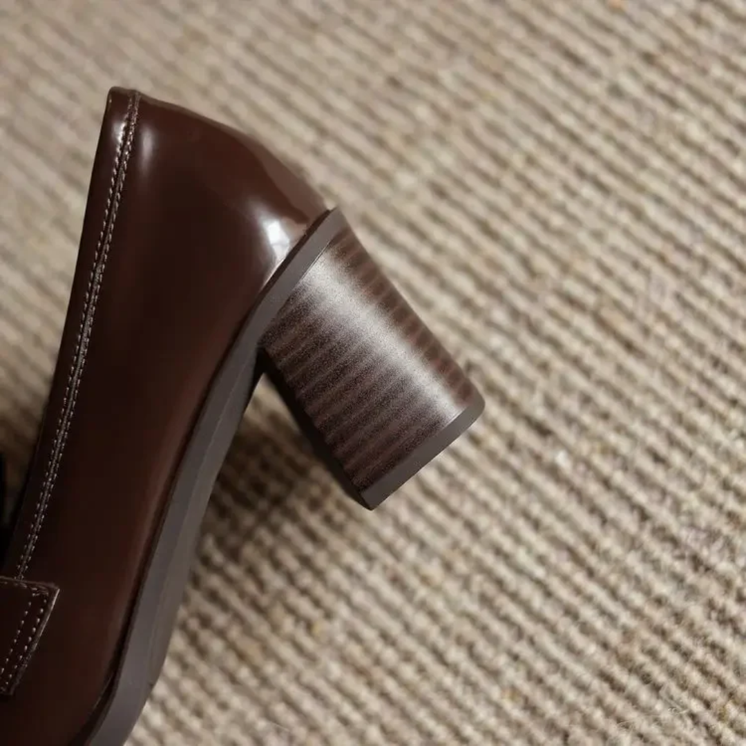 Brown loafer pump shoe with block heel, stitched apron detail