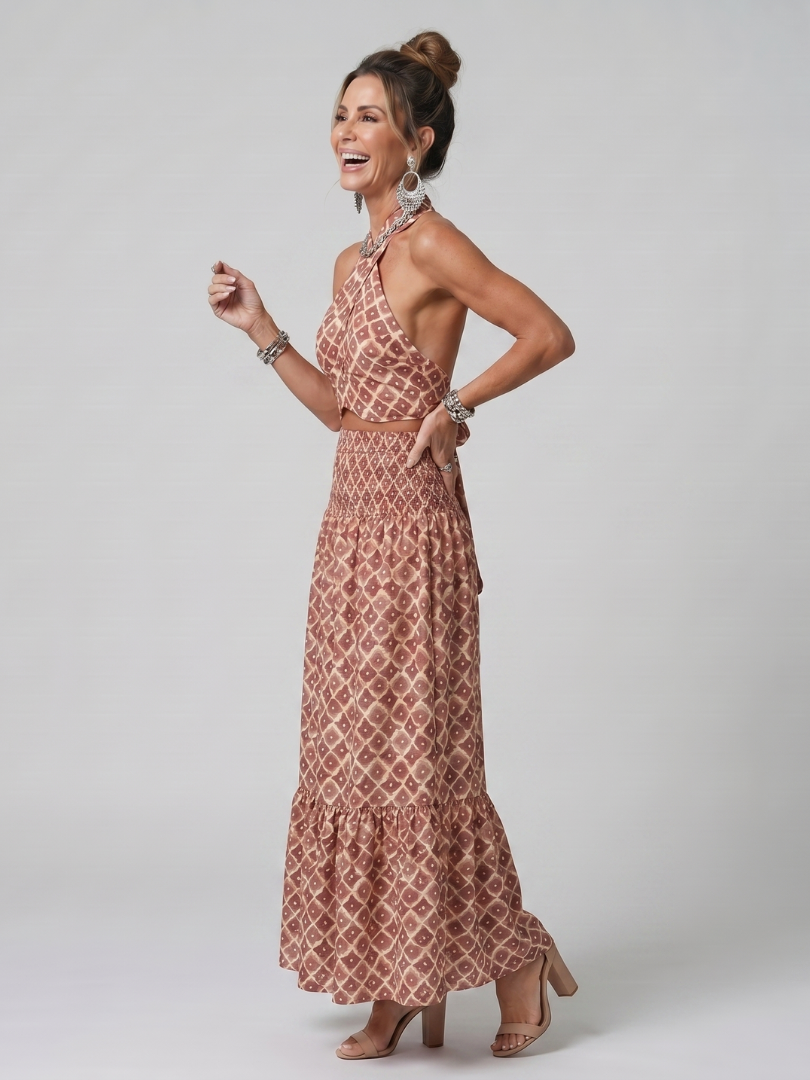Dusty rose geometric print halter midi dress with low open back and tiered skirt