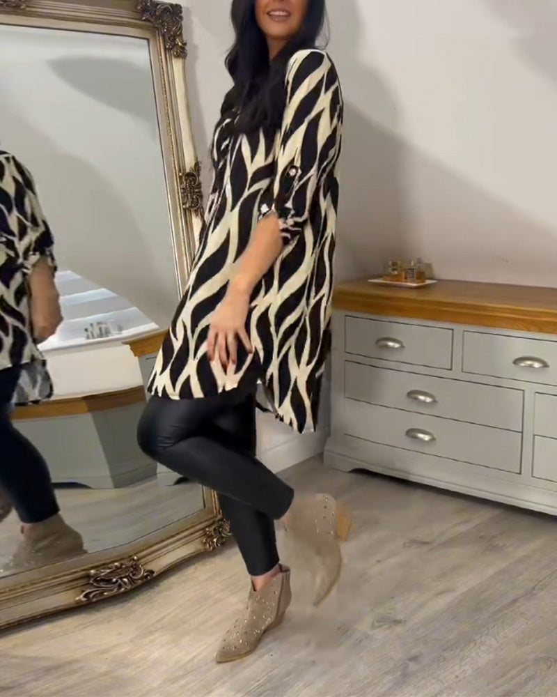 Printed loose-fit top with V-neck and abstract zebra pattern, side view