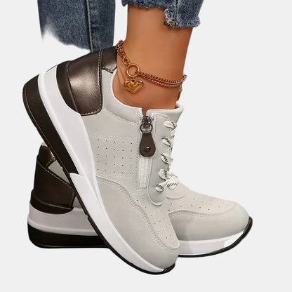 Orthopedic shoes in white with white laces and bronze side panels, cushioned platform sole
