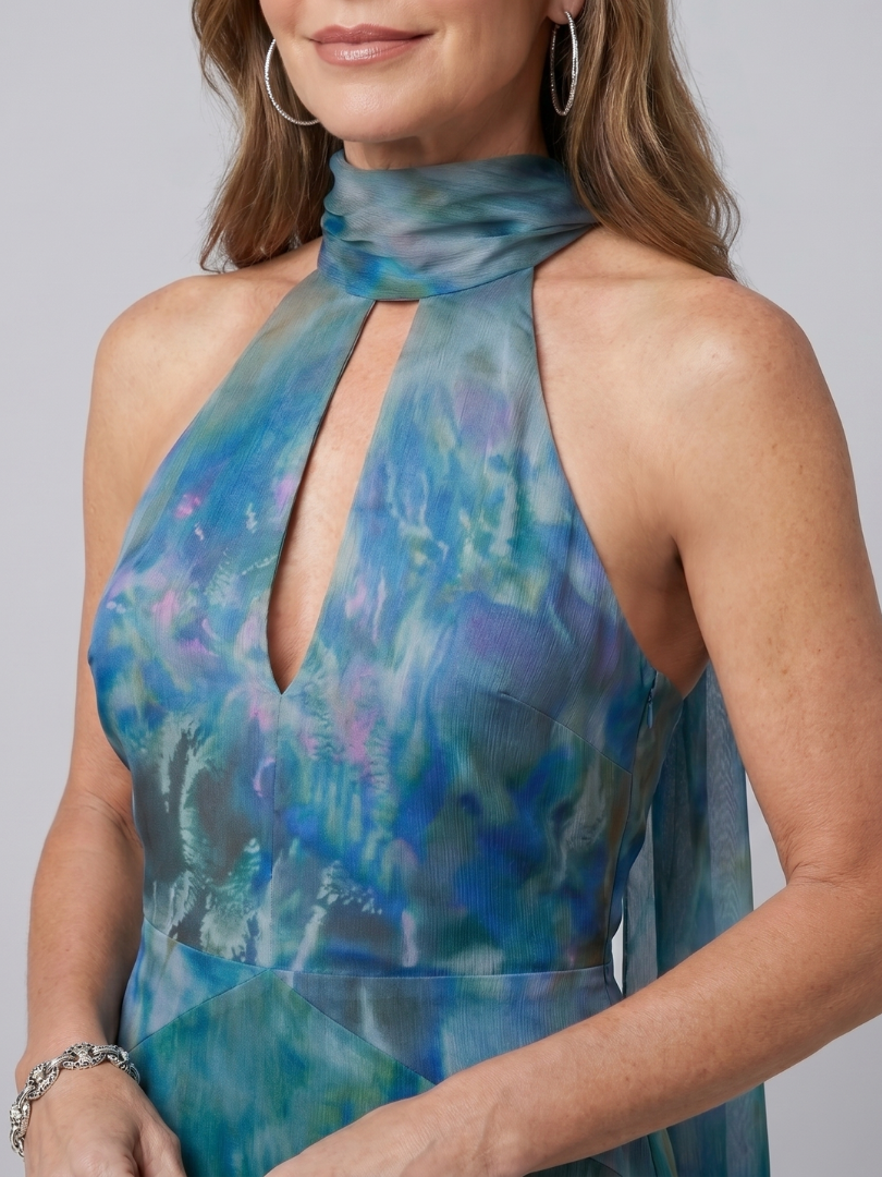 Blue halter maxi dress neckline close-up with keyhole cutout and gathered scarf collar