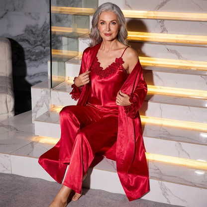Red satin camisole with lace neckline, long robe, and matching wide-leg pants