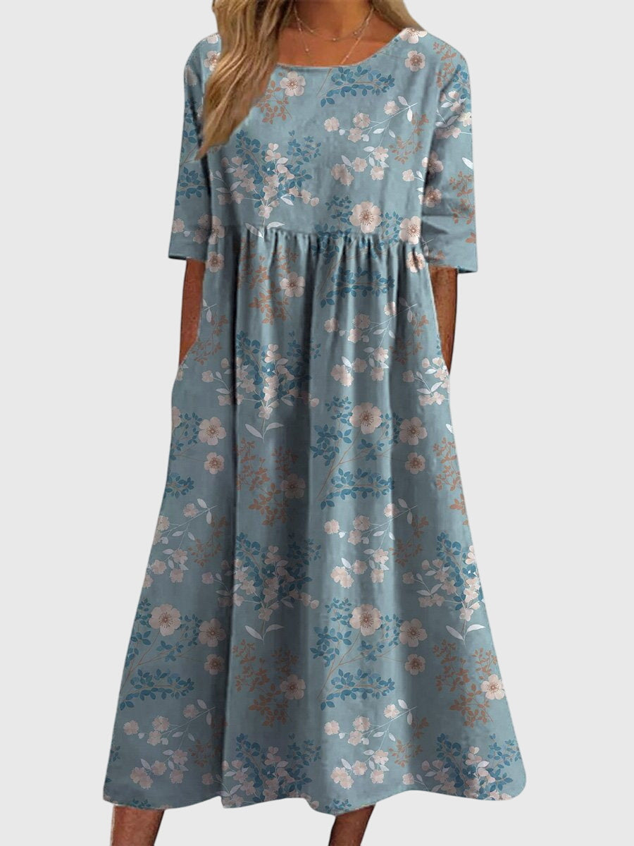 Relaxed midi dress in dusty blue with small floral print, short sleeves, gathered waist