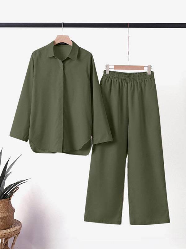 Olive-green two-piece set on hangers: button-up shirt and wide-leg trousers.