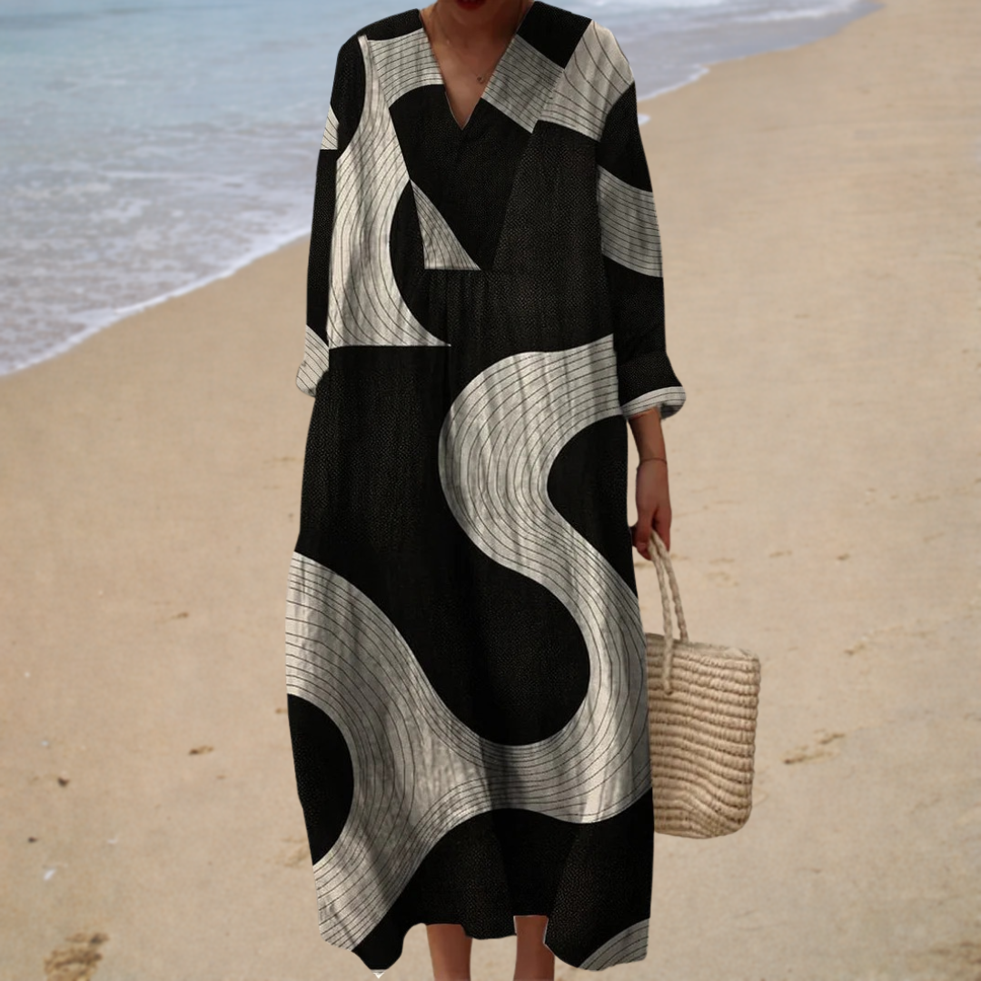 Black and white printed summer dress with V-neck, three-quarter sleeves, midi length.