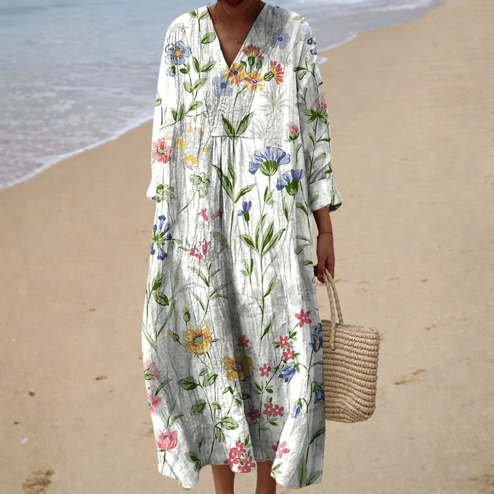 Floral printed summer dress with V-neck, loose fit, and three-quarter sleeves