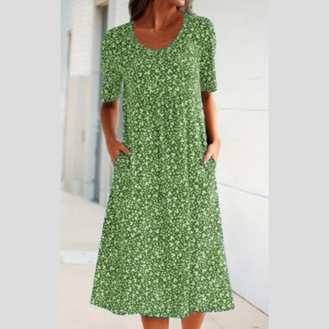 Floral summer dress in green with short sleeves and scoop neckline, midi length