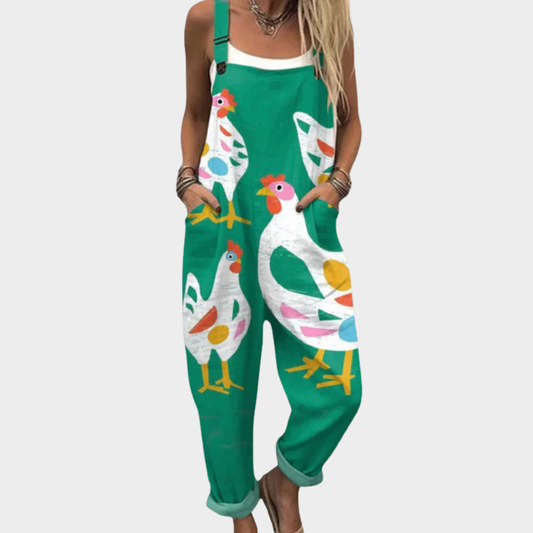 Green printed overalls with colorful bird motif, adjustable straps and front bib