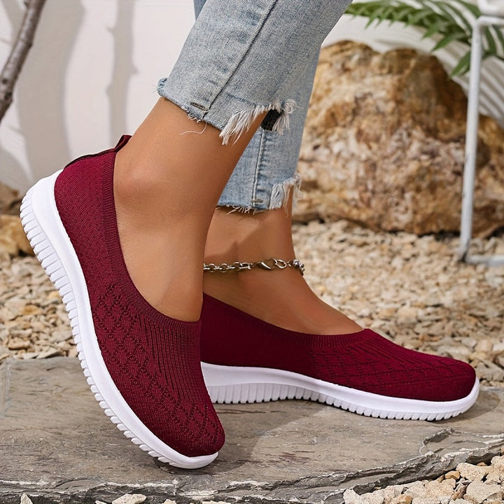 Non-slip knit slip-on shoes, burgundy with white rubber sole, side view