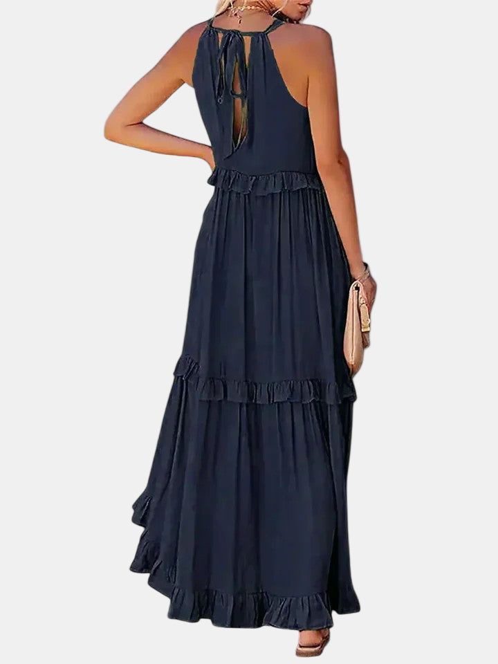 Dark blue sleeveless long dress with keyhole tie back and tiered ruffled skirt