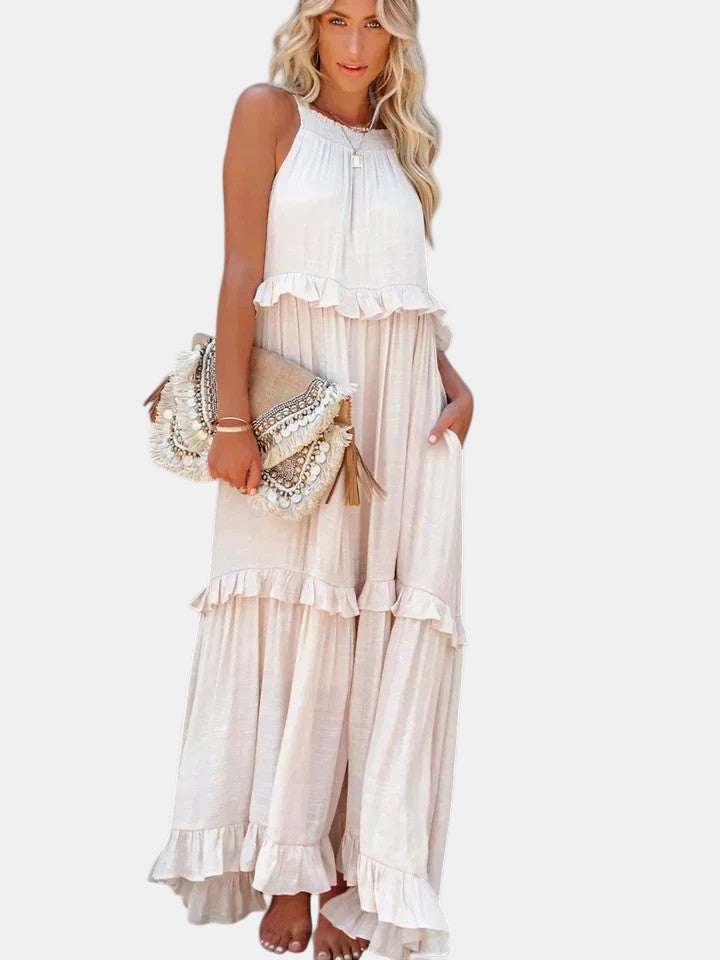 Cream sleeveless long dress with tiered ruffle skirt and gathered high neckline