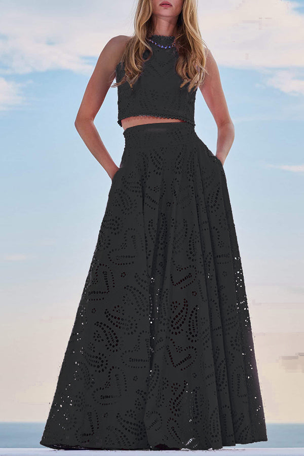 Black embroidered sleeveless crop top and high-waist maxi skirt set with eyelet pattern