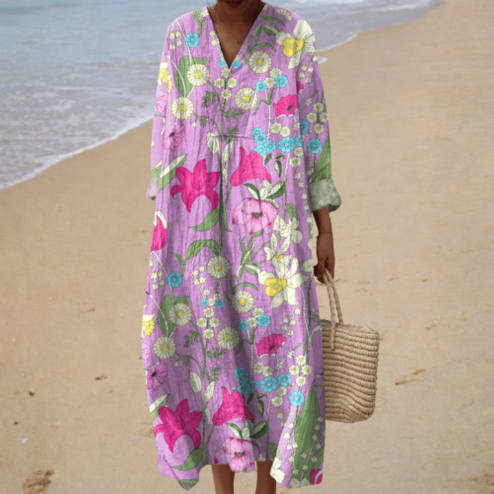 Floral printed summer dress with V-neck, three-quarter sleeves, and long flowing fit