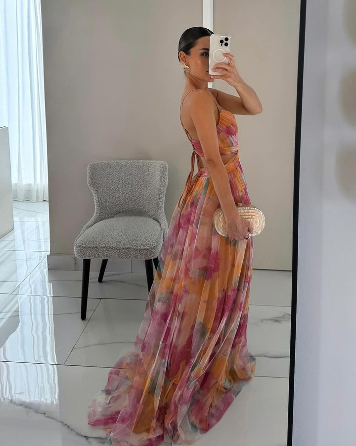 Multicolor maxi dress with V-neck bodice and flowing pleated skirt, side view