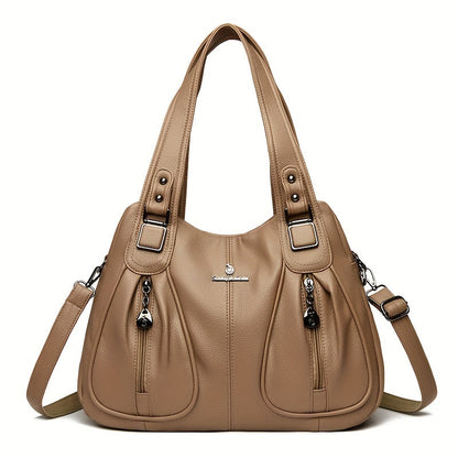 Women’s casual shoulder bag in beige with top handles and adjustable shoulder strap.