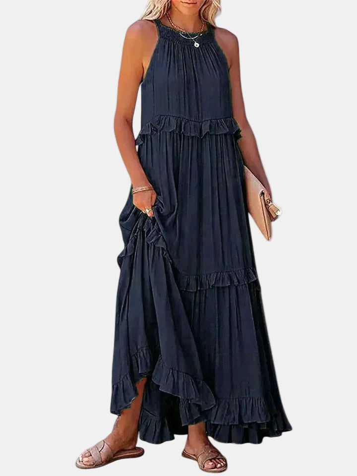 Dark blue sleeveless long dress with tiered ruffle hem and gathered neck