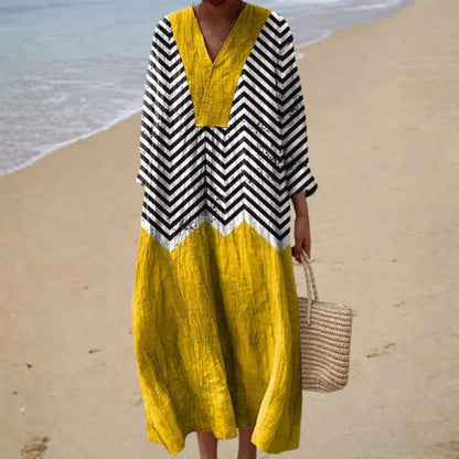 Printed summer dress with black zigzag stripes and mustard yellow paneling