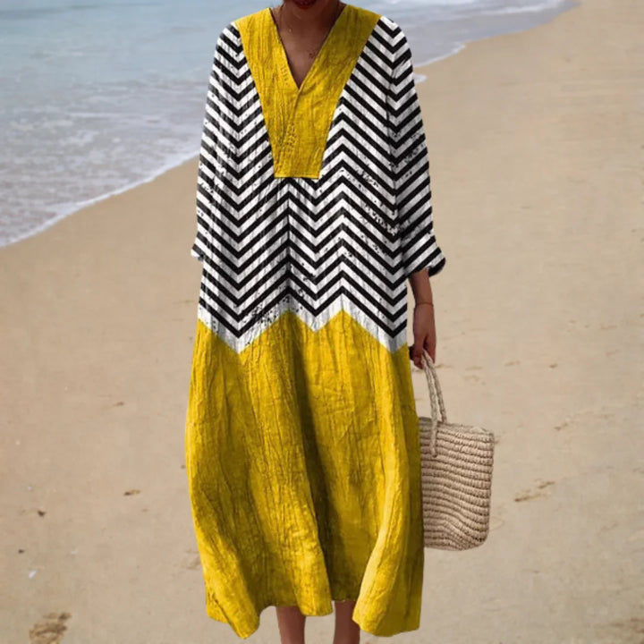 Printed summer dress with black zigzag stripes and mustard yellow paneling