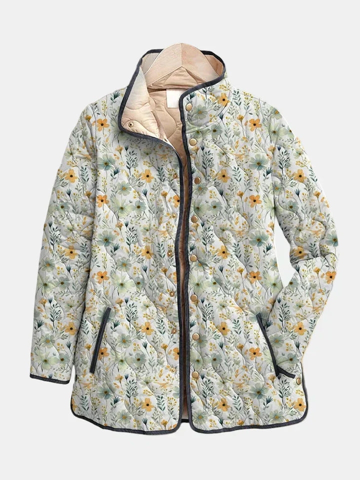 Floral-printed quilted jacket with dark trim, full front zipper and button placket