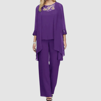 Purple three-piece set: lace-trim top, draped jacket, matching tapered trousers.