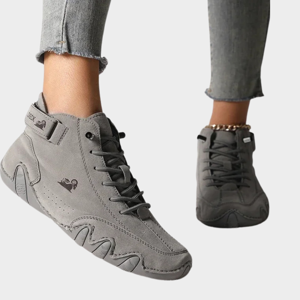 Gray orthopedic ankle boots with lace-up front, cushioned sole and side pull tab