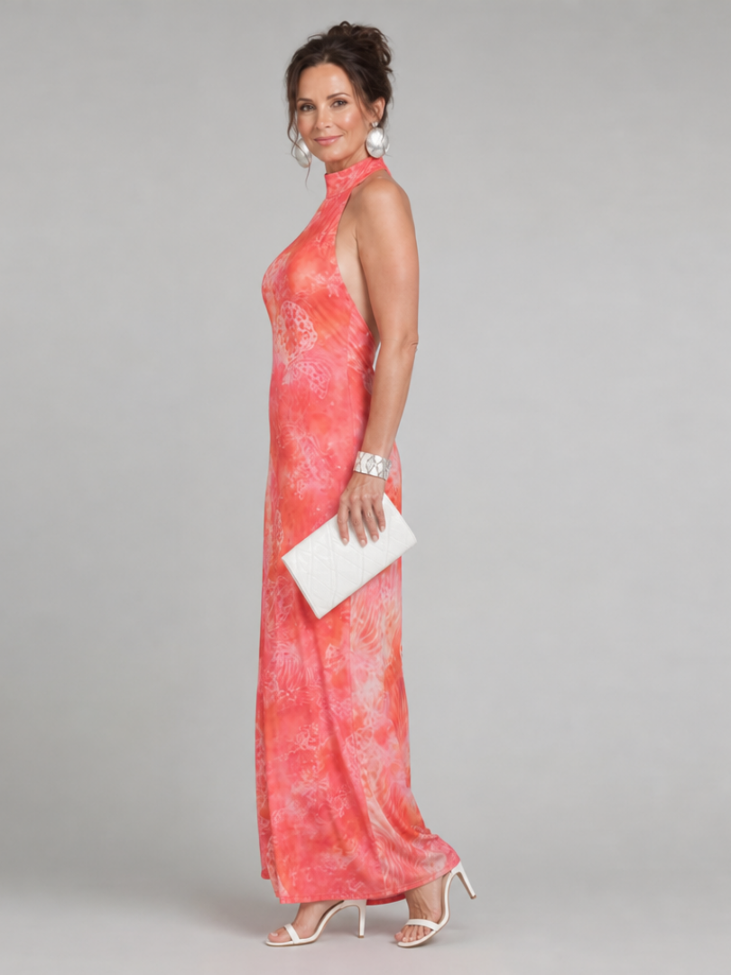 Coral-orange halter-neck maxi dress, sleeveless with printed pattern