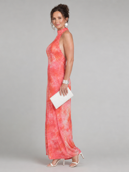 Coral-orange halter-neck maxi dress, sleeveless with printed pattern