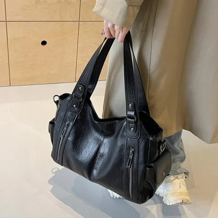 Black large shoulder bag with crossbody strap and dual front zippers