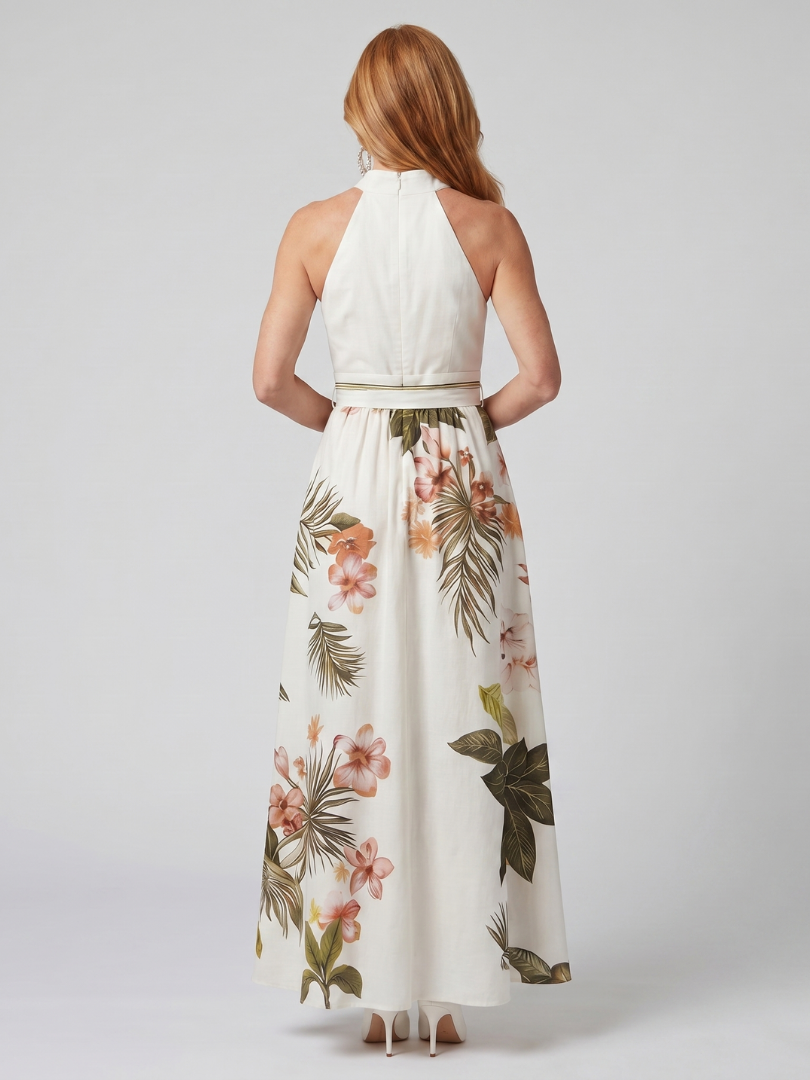 Back view: white halter maxi dress with open-back straps and floral botanical skirt