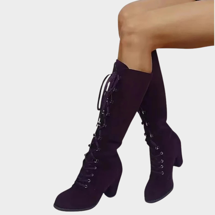 Purple suede lace-up high heel boots with ankle-length uppers and stacked heel.