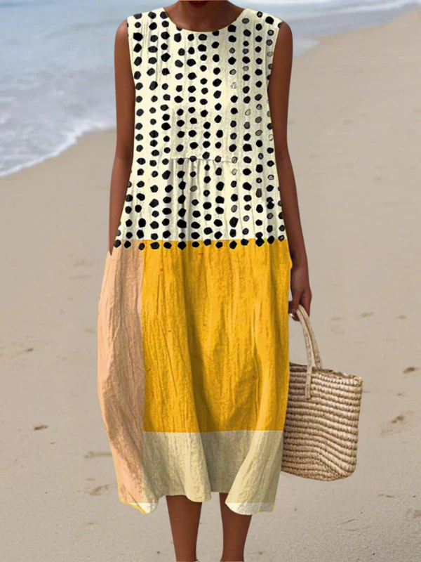 Sleeveless polka-dot midi dress with yellow and cream colorblock panels, round neckline