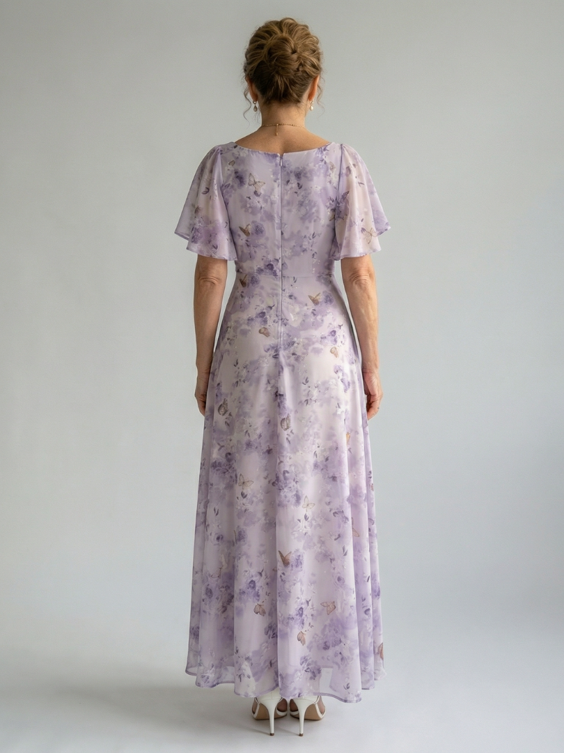 Back view of lavender floral midi dress with flutter sleeves and gathered waist seam