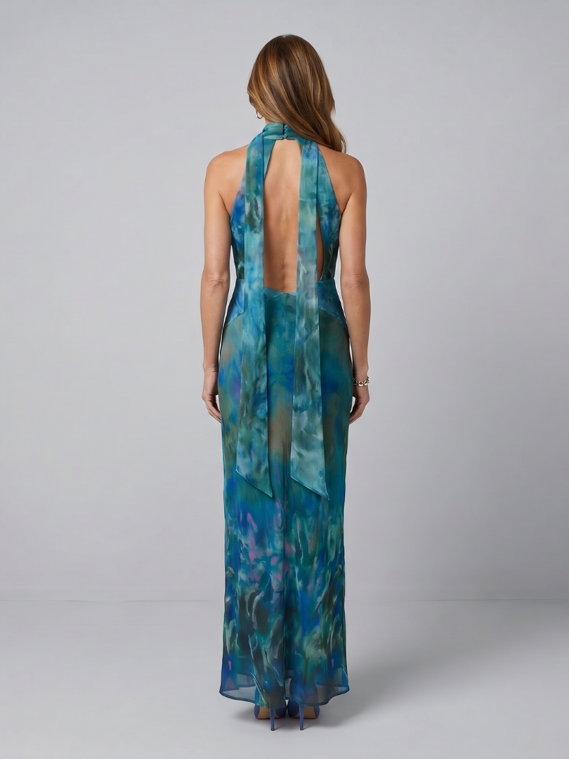 Blue halter sleeveless maxi dress back view with open strap panel and draped skirt